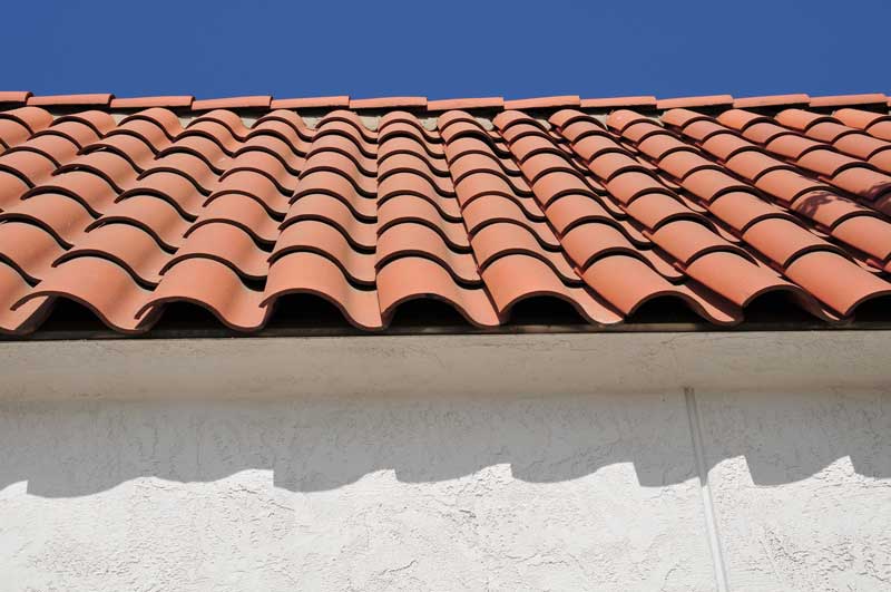 terracotta tiled roof against a blue sky